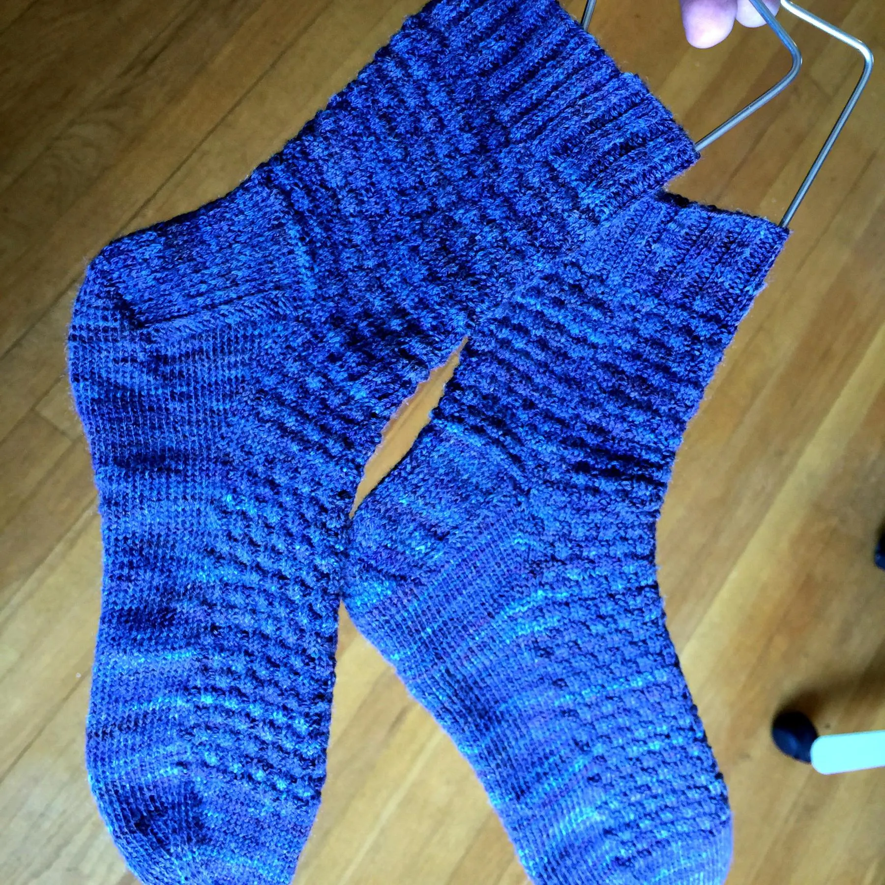 The important thing is the blocking, not me going crazy with filters. finished socks on sock hangers