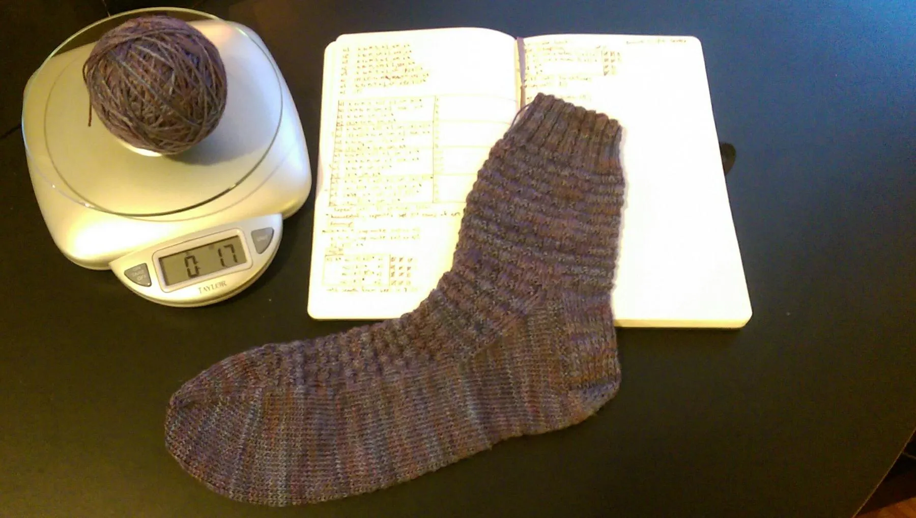 The sock weighed 1.3 ounces sock laid flat, with remaining yarn on scale