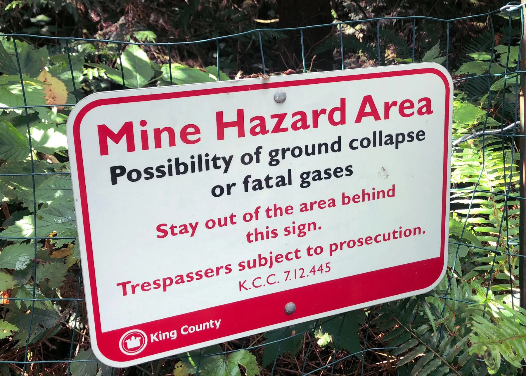 Pay attention to the warning signs sign warning of ground collapse or fatal gases